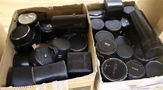 Three boxes of cameras and lenses